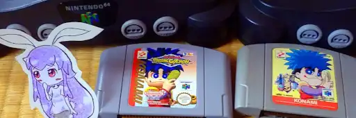 Two Nintendo 64. Japanese and PAL versions of the Goemon's Great Adventure cartridges.